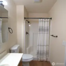 Second PRIMARY BEDROOM with small lip to full shower