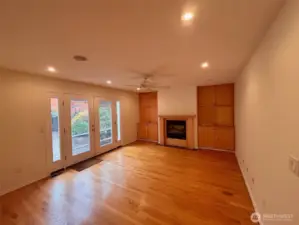 Family Room - built-in cabinets, ceiling fan, french doors to backyard patio