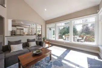 Vaulted ceilings & floor-to-ceiling windows let in natural light.