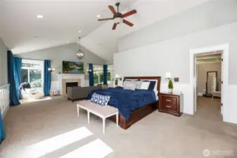 MAIN floor Primary Suite with living room & two walk-in closets.