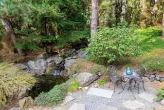 Koi pond adjacent to the main floor primary suite.