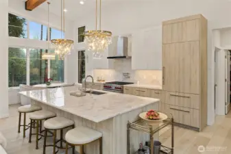 This gourmet kitchen with Sub-Zero refrigerator, Wolf 6-burner gas range, Cove dishwasher and custom cabinetry with quartzite countertops is ready for all your entertaining.