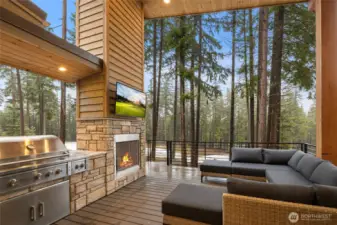 Step on out from the great room to the expansive covered deck providing year round enjoyment. Edgestar 36" grill with rotisserie & side burner and views of the 11th hole of the Prospector course. A spiral staircase takes you to the lower level outdoor living.
