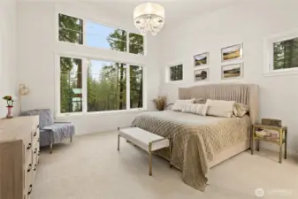 The primary suite offers a spa-like retreat on the main level.