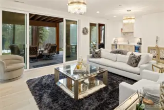 Lower level spacious recreation room with wet bar & GE dishwasher and second gas fireplace opens to an outdoor oasis: covered patio, hot tub, gas fire table and 36" fire pit.