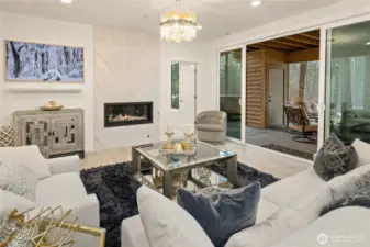 Lower level recreation room with fireplace, Samsung Frame TV and Sonos Sound System with wall mounted soundbar, two ceiling rear speakers.
