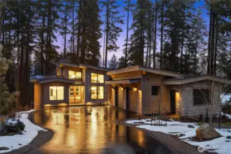 Heated two-car garage offers EV charging & generator hookup. Solar panels, underground irrigation, tankless hot water & dual-zone HVAC ensure efficient living.