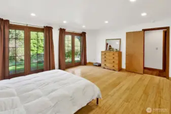 Primary bedroom with a private natural views. The 3/4 bath just outside the door.