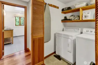 Laundry room in hallway closet outside the primary bedroom and bath. Appliances included in sale.