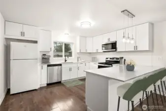 Kitchen with breakfast bar *virtually staged*