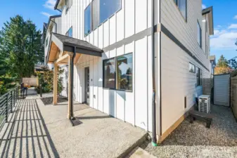 Gated front patio perfect for furry friends! Check out pet door and storage.