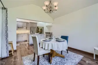 Soaring ceilings add to the grand spacious feeling in the dining/kitchen area.