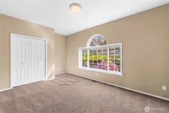Main level bedroom facing East for beautiful lighting