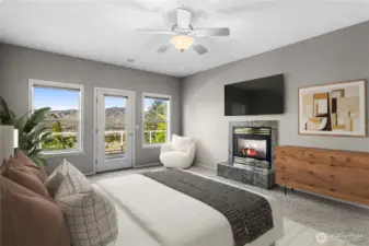 ambiance in primary bedroom suite with relaxing gas fireplace and view.