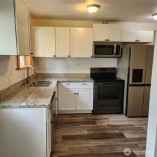 All kitchen appliances stay!  Flooring, cabinets, counter tops are all newer.