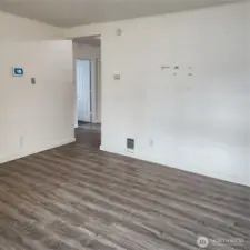 Another angle of the living room area leading to the kitchen