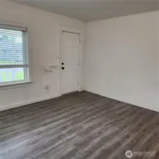 Another angle of living room area, this home just need your personal design of paint