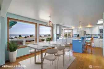 Dining area with more views. Open to the kitchen & living room. Virtually staged.