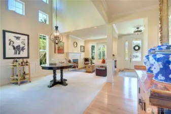 Main floor from the hallway with hardwood floor open floor plan with formal dining room and living room.