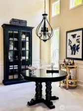 Formal dining room with soaring ceiling and new lighting fixture.