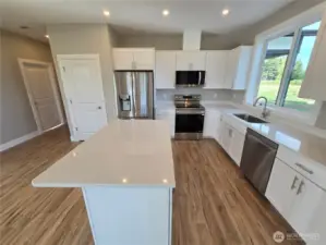 Classy Kitchen with Quartz Counters and Stainless Steel Appliances