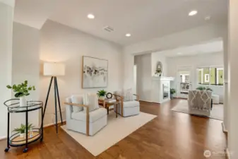 The main living area is designed for comfort and entertaining. A spacious living room with oversized windows and durable flooring anchors the space, while the adjacent dining area is perfectly positioned for everyday meals or hosting friends and family.