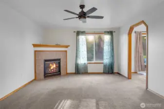 View from entry way- living room w/ gas fireplace