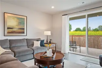 Living room with slider to back deck