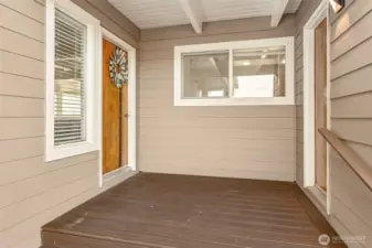 Covered entry with access to the utility room.