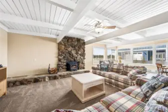 Open, bright and coastal with a beautiful wood stove.