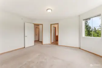 Primary Bedroom facing Primary Bathroom and hallway.