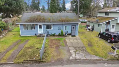 Current side yard being used for additional parking, leave as is or redo lawn area, seller $18K credit for new roof!