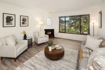 Spacious living room centered around a cozy wood-burning fireplace.