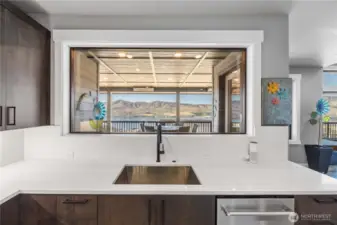 Kitchen features massive picture window.