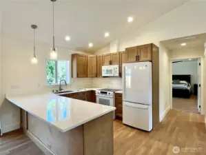 Just steps away from the kitchen is access to the Primary Bedroom, Laundry and Garage