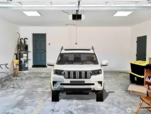 Large 2 car garage with E-Car charging station. Virtually Staged