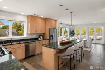 Enterainer's kitchen impresses with large center island, 10-seat dining, flowing effortlessly to the expansive view deck.