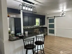 Kitchen with counter eating space and dining space