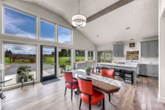 The main living is encompassed with large windows, overlooking the property and on a clear day Mt Baker.