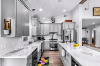 Full kitchen remodel completed in 2025 along with home renovation - soft close cabinets, all new appliances, range is gas & electric, trash compactor AND beverage fridge for additional storage space.