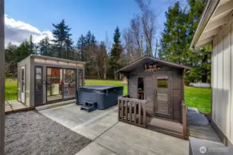 Green house/potting shed, hot tub and sauna for year round enjoyment. There is also an outdoor shower for quick clean ups after a steam, soak or even a long day of working in the yard