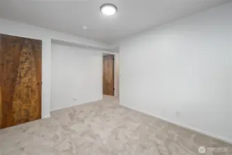Lower level, front bedroom or bonus room.