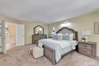 Spacious primary bedroom has double door