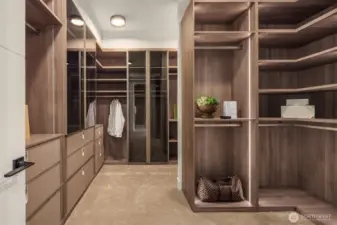 This oversized closet is beautifully finished with high-end custom caibnetry.