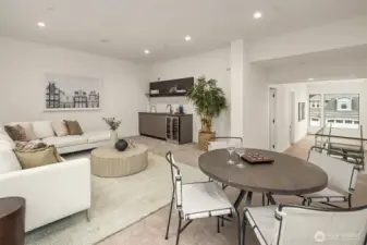 A loft or second living area located on the upper level is complete with a wet bar with a mini fridge/wine cooler and built-in speakers.