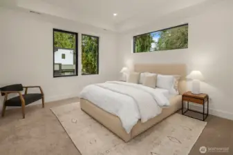 One of three ensuite bedrooms complete with high-end custom cabinetry in the closets.