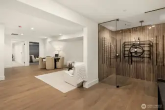 The lower entertainment level, complete with a wine cellar when you first walk down! This space also features a wet bar with a fridge and microwave.