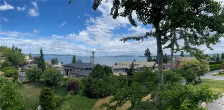 Panoramic view of the Sound looking out toward Three Tree Point, Vashon & Maury Island, the Olympic mountains & sunsets.