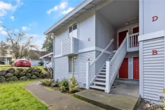 Fresh charming entrance with newly rebuilt stairwell and railings with pressure treated wood and painted!