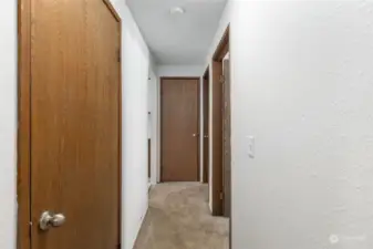 Hallway offers additional buffer zone between living/kitchen and bath/ bedroom areas. Plus provides more wall space many renters lack for floor length mirror or decor.